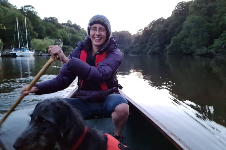 Transition Streets project manager, Ruth Leonard-Williams, with her dog Bramble enjoying a paddle on the River Dart.