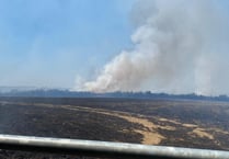 Fire rages across fields