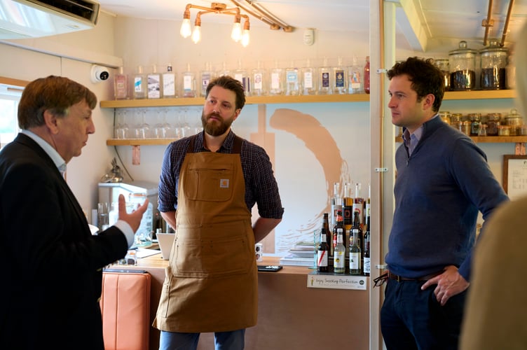 MP Anthony Mangnall (right) and minister Sir John Whittingdale (left) discuss gin-making at Devon Distillery