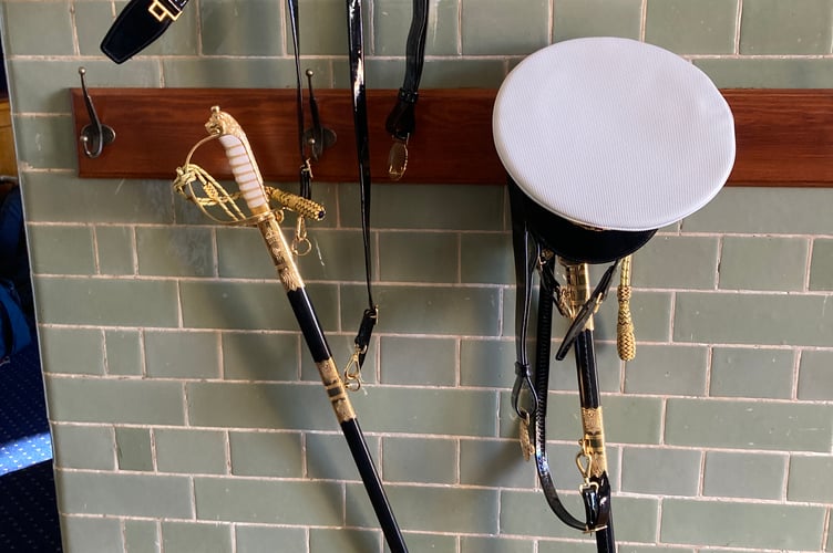 Swords and cap await