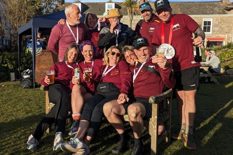Members of the Dartmouth men's and women's pilot gig teams celebrate