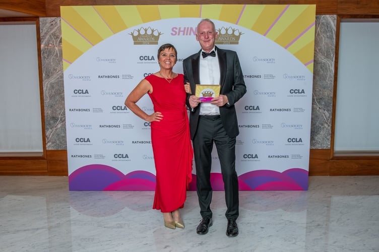 Chris and Julie Parsons accepting an award for LandWorks