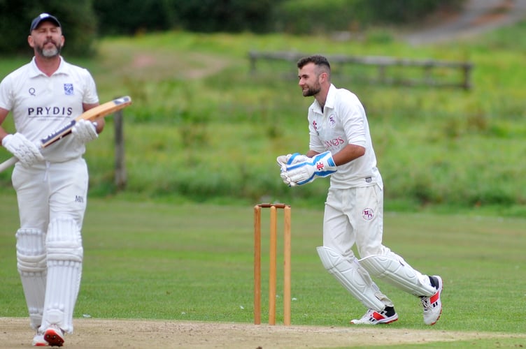 Devon Cricket League D Division West. Kenn versus Dartington and Totnes. A wry grin from D&T 'keeper Alex Perkin as Kenn skipper James Mason is caught out by Justin Osborne from a ball by Alastair Selby
