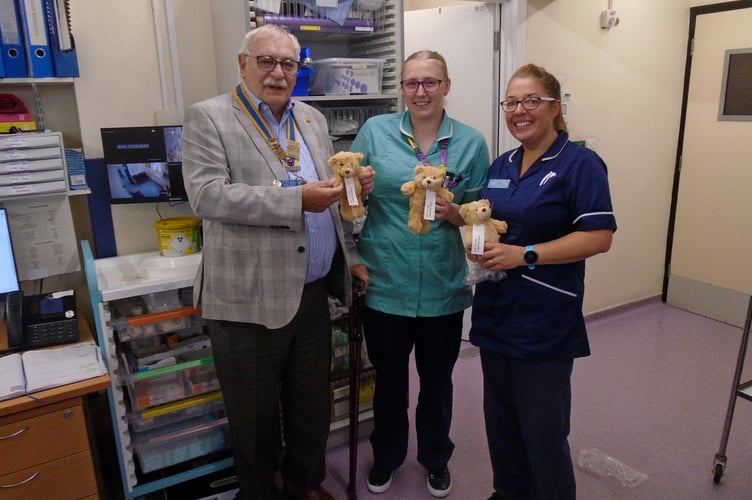 Nurses receiving teddy bears from Kingsbridge Rotary Club President Alan Thorpe