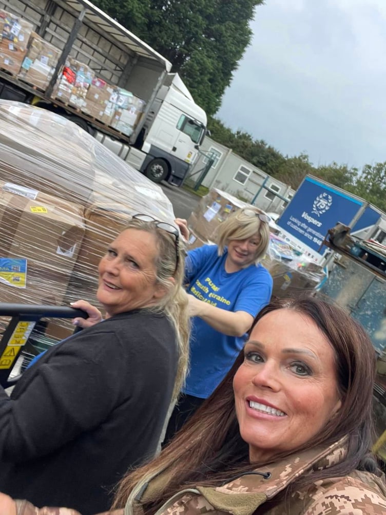 Founder Ali Piper and her team help with the loading