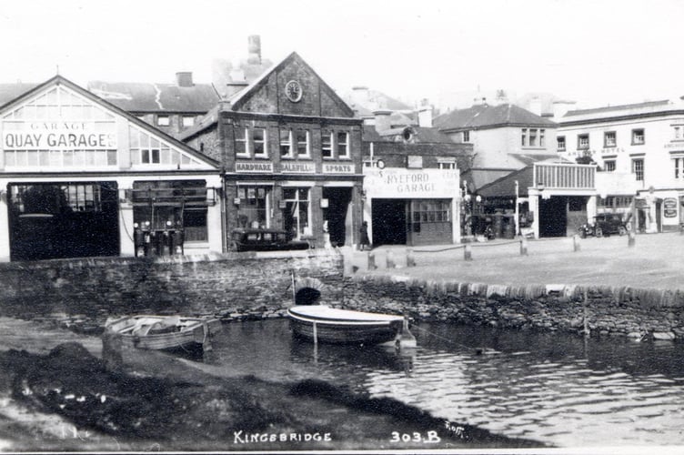 Head of Kingsbridge estuary when it reached up to Quay Garage. Shows Balkwills hardware and sports shop and Ryeford Garage. 