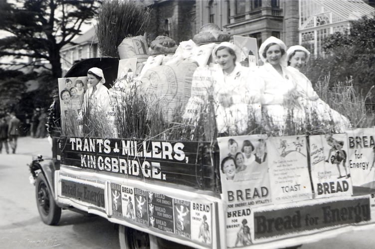 1937 Trants, millers, Coronation carnival float with girls on back. 
Taken in front of Victoria Place, Promenade, Kingsbridge.