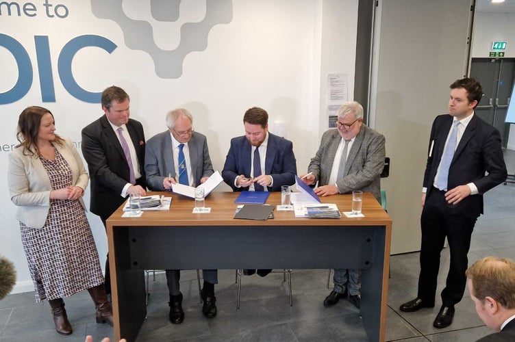 Signing the Torbay/Devon devolution deal (from left Alison Hernandez, Kevin Foster John Hart, Jacob Young, David Thomas, Anthony Mangnall) (Picture courtesy: Guy Henderson)
