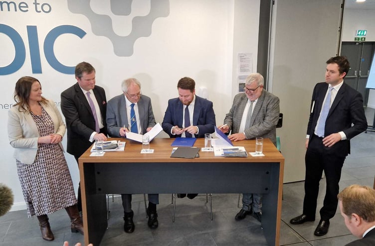 Signing the Torbay/Devon devolution deal (from left Alison Hernandez, Kevin Foster John Hart, Jacob Young, David Thomas, Anthony Mangnall) (Picture courtesy: Guy Henderson)