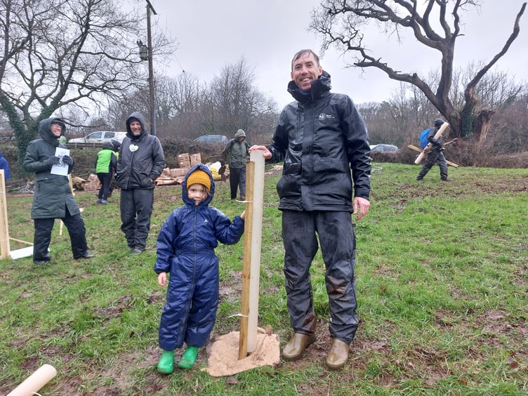 Devon Wildlife Trust CEO Nick Bruce-White with five-year-old Phoenix, who planted the first tree