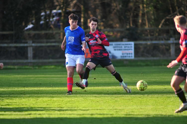 Football.South West Peninsula Premier League East.  Bovey Tracey versus Newton Abbot Spurs. A two goal away win for Spurs at Mill Marsh Park