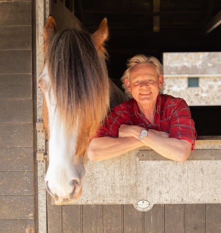 Martin Clunes is the special guest due to open the Devon County Show heavy horse festival in May.  The actor is pictured with his own Clydesdale horse Patrick.
