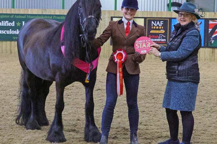 Alexandra Whitell and Kalmara Felicity receive their prize from Amanda Gomersall.