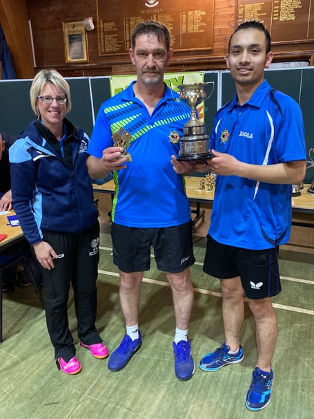 Sonja Ryland with men’s doubles winners Chris Harper & Aarish Maharjan