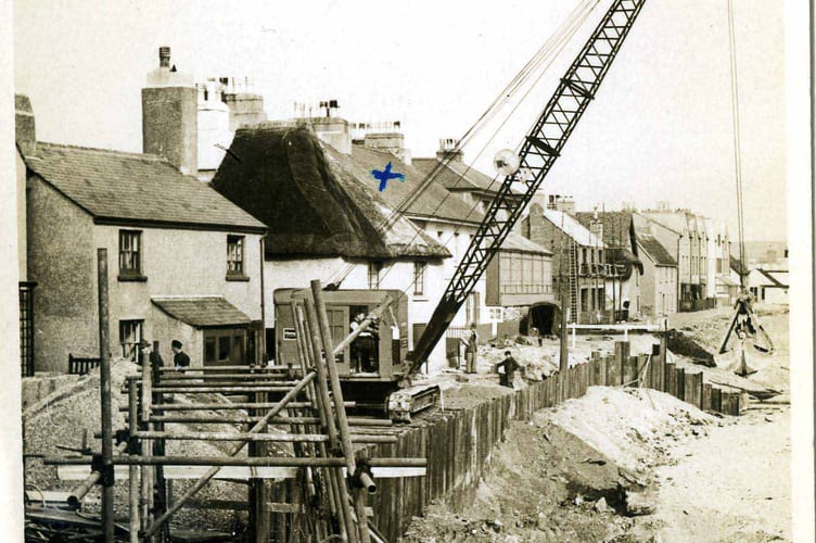 Black & white postcard. Building Sea Wall reinforcements at Torcross.