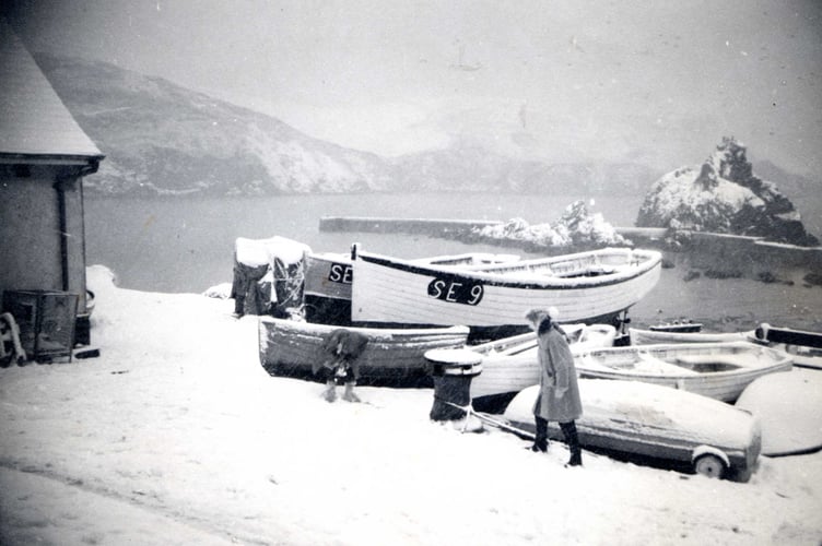 Boats at Hope Cove after a snow fall. 1950's