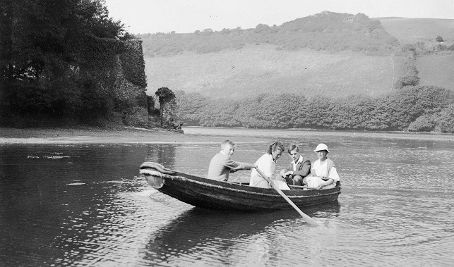 Four people in small boat on Kingsbridge estuary