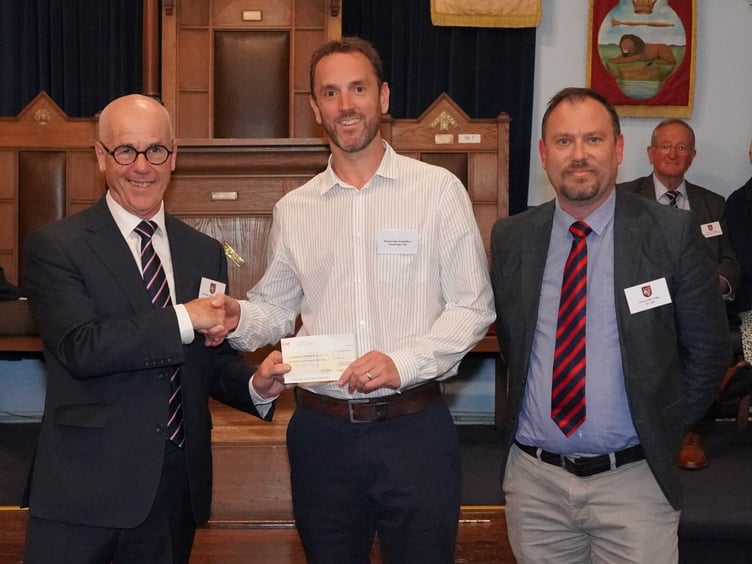 Chairman Dan Quiggin accepts a cheque for £1500. Courtesy of John Smerdon, Photographer for the Provincial Grand Lodge of Devonshire