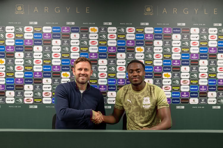 Head of Football Operations David Fox welcomes new signing Owen Oseni to Home Park following his move from St Mirren. Picture: (Plymouth Argyle FC)