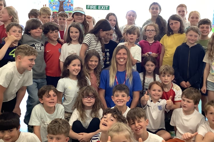 Meg Niblett, professional competitive sailor, with children from Blackawton Primary School