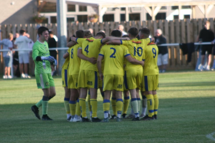 Okehampton Argyle team huddle