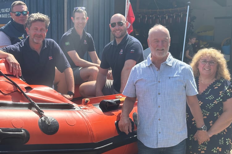 Neil and Jackie Bascombe with Dart RNLI volunteers (l to r) Rich Eggleton, Stuart Millard, Chris Lee and Tom Shanley