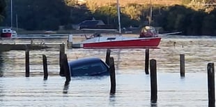 Driver and dog rescued from rising tide at Westcombe beach
