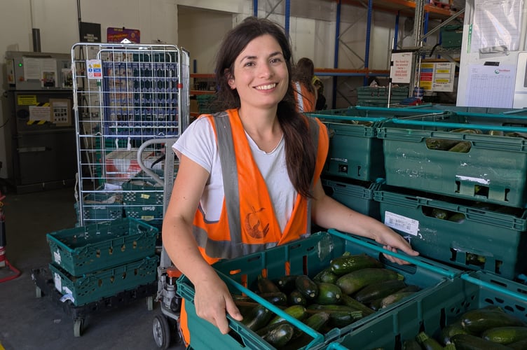 FareShare South West volunteer Zoe with some courgettes.
