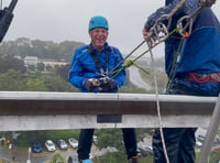Leap of faith in appalling weather as fundraisers abseil off Derriford