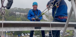Leap of faith in appalling weather as fundraisers abseil off Derriford