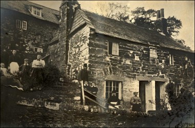 Cottages at South Milton, with group of people outside