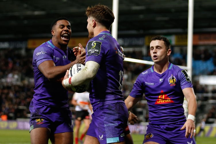 Exeter's Henry Slade is congratulated on his try by Immanuel Feyi-Waboso and Charlie Chapman as the Chiefs kicked off their European campaign with victory over the Cheetahs