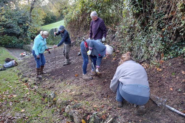Planting bluebell bulbs, Paul with his bespoke dibber - Fiona van Es
