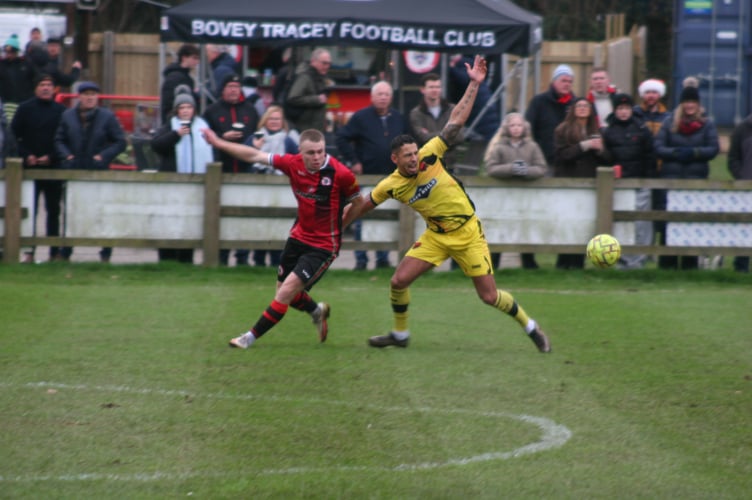 Ollie Aplin and Jordan McCarthy battling away.