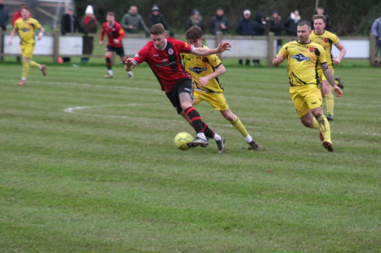 Ollie Webber breaks away from Stoke defenders.