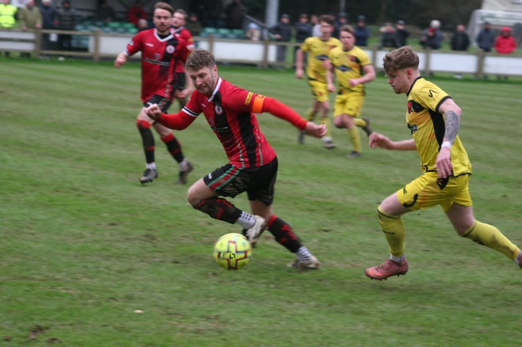 Saul Vanes looks to drive beyond Cliff Walters.