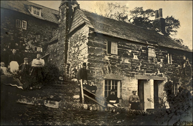 Cottages at South Milton, with group of people outside