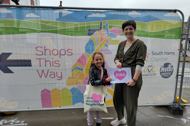 Loyalty Card Competition Winner Ren with South Hams Chamber chair Samantha Dennis 