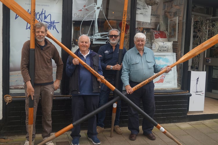 Pictured (centre) is Basil Williams with artist Paul Barclay along with Regatta committee member Yorkie Lomas (far left) and president Hilary Bastone