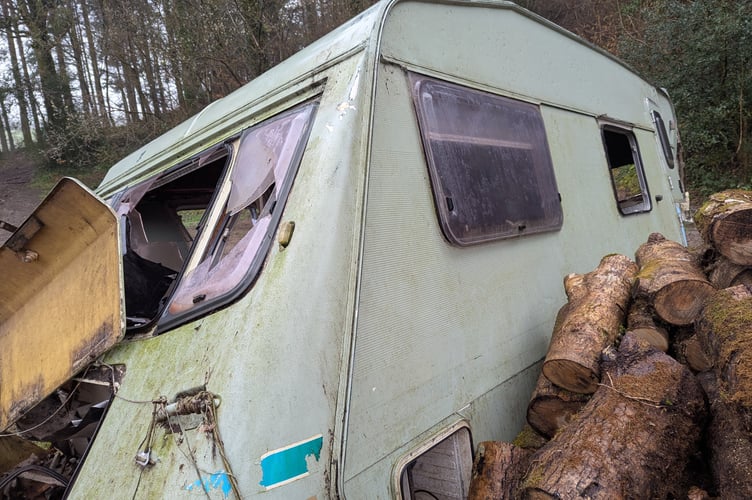 A caravan dumped in woods near Gara Bridge.