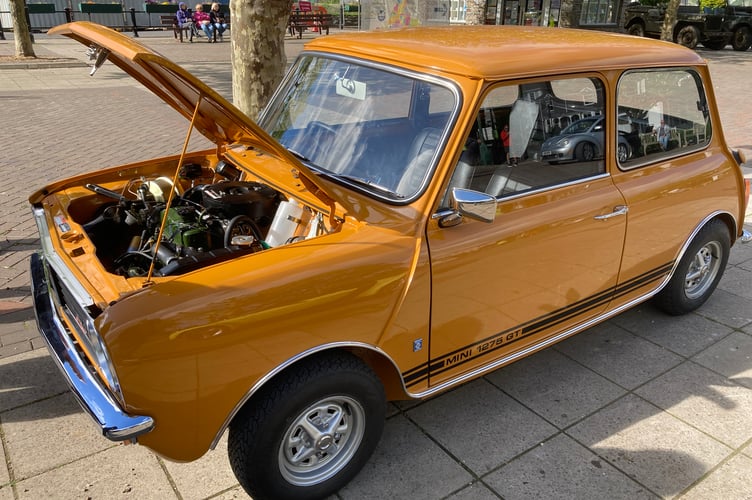 An orange Mini 1275 GT