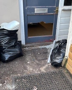 Door smashed in by burglars at Teign Bean, Exminster